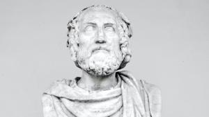 A white bust of a greek philosopher.